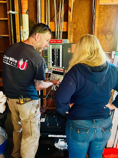 Brian explaining electrical panel work to a customer