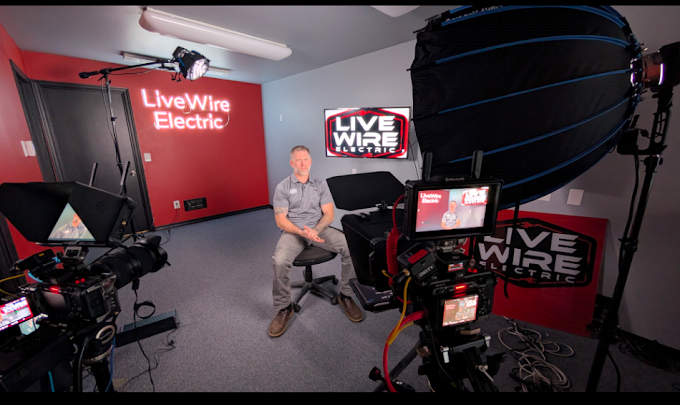 Brian seated in the Live Wire Electric shop during a filmed interview