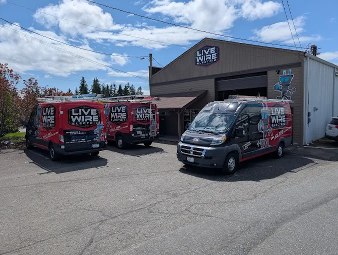 Live Wire Electric service vans parked outside the company shop
